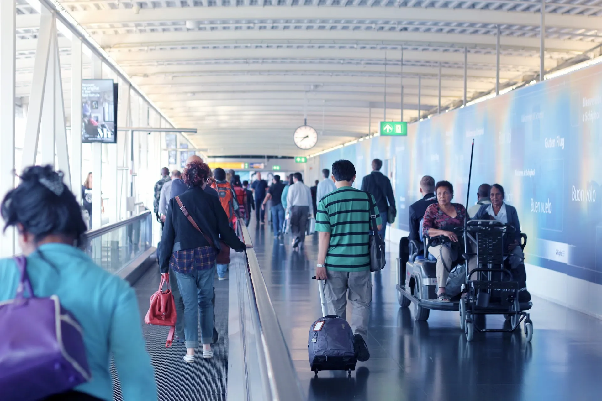Travelers at Schiphol Airport arriving to the Netherlands